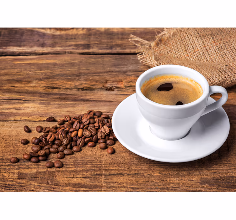 Coffee on a wooden table wall mural - TenStickers