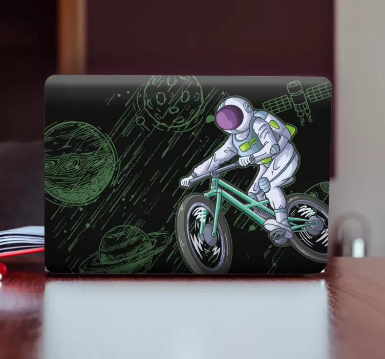 Laptop sticker astronaut on bicycle - TenStickers
