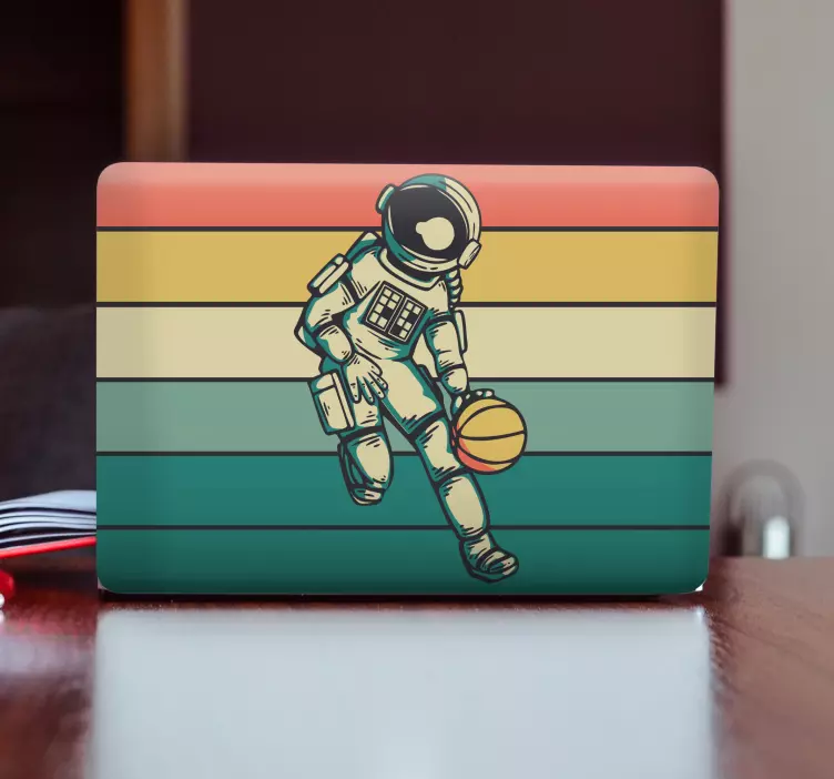 Astronaut Playing Ball laptop skin - TenStickers