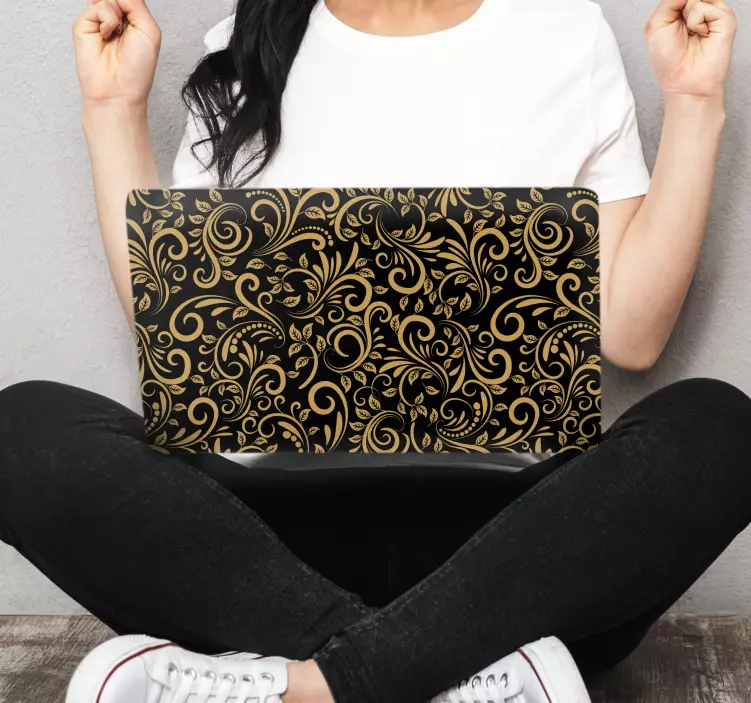 Golden leaves over a graphite laptop skins - TenStickers